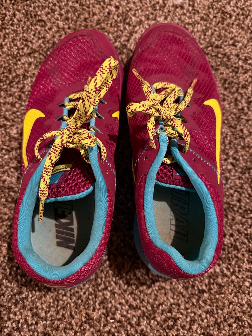 Nike women’s Maroon Sneakers with Yellow Swoosh and Teal Lining